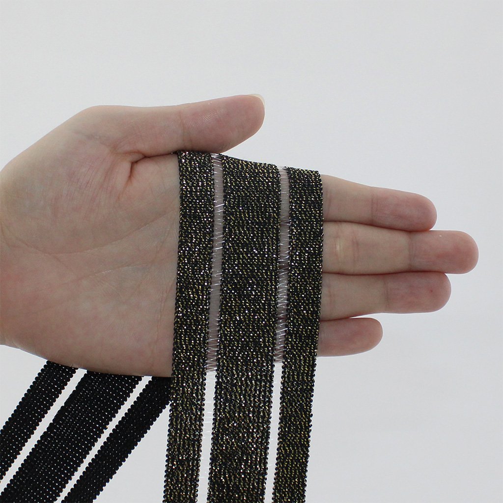 ELÁSTICO VAZADO GLOW 4,8cm PRETO/OURO 25m ELÁSTICO VAZADO GLOW 4,8cm PRETO/OURO 25m